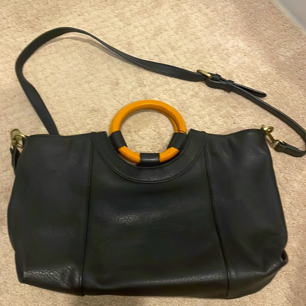 Anthropologie purse with wooden handles.